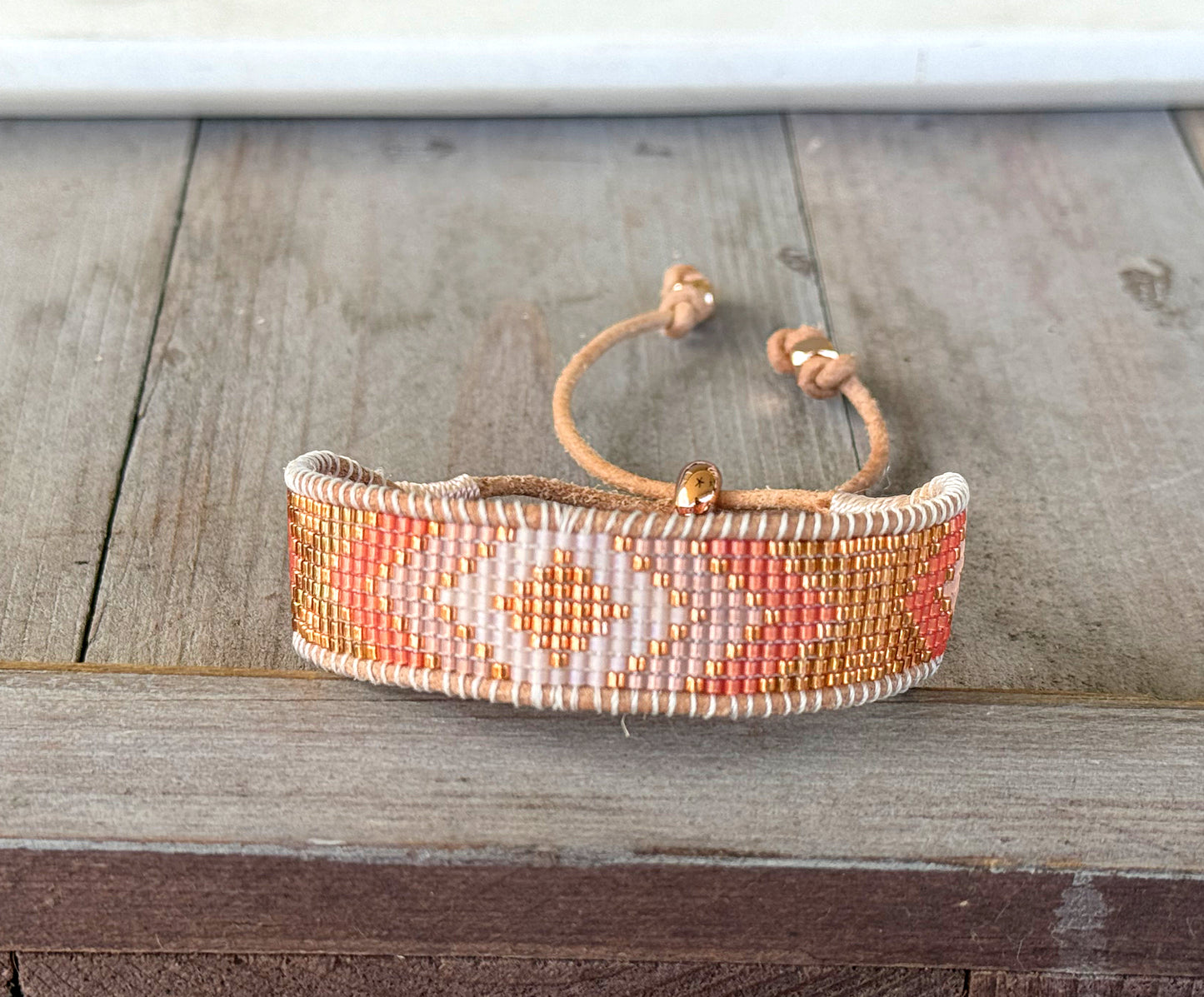 Peachy Coral and Tan Adjustable Bead Loom Woven bracelet with leather trim