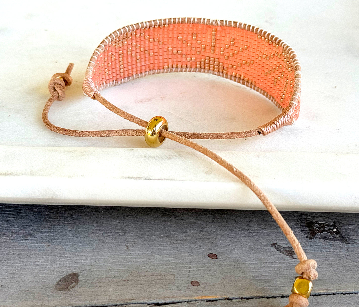 Slide adjustable peach and gold bead loom woven bracelet
