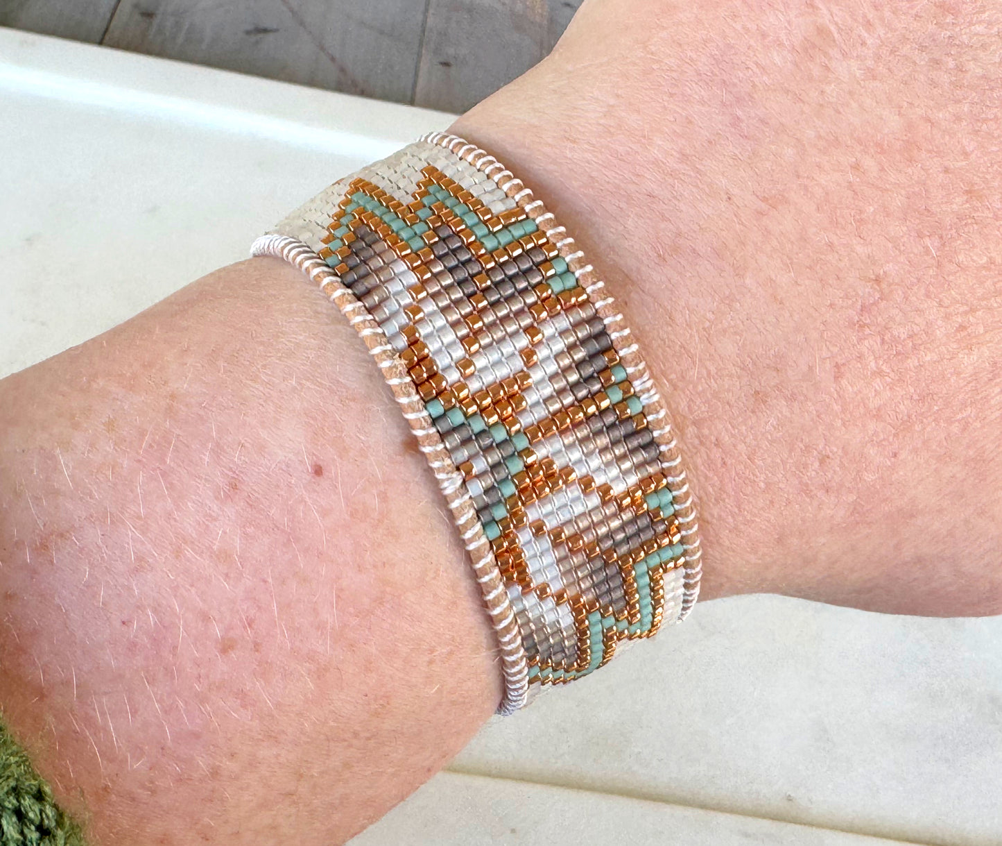 Sage, Ivory, Copper Starburst beaded loom woven bracelet trimmed with leather