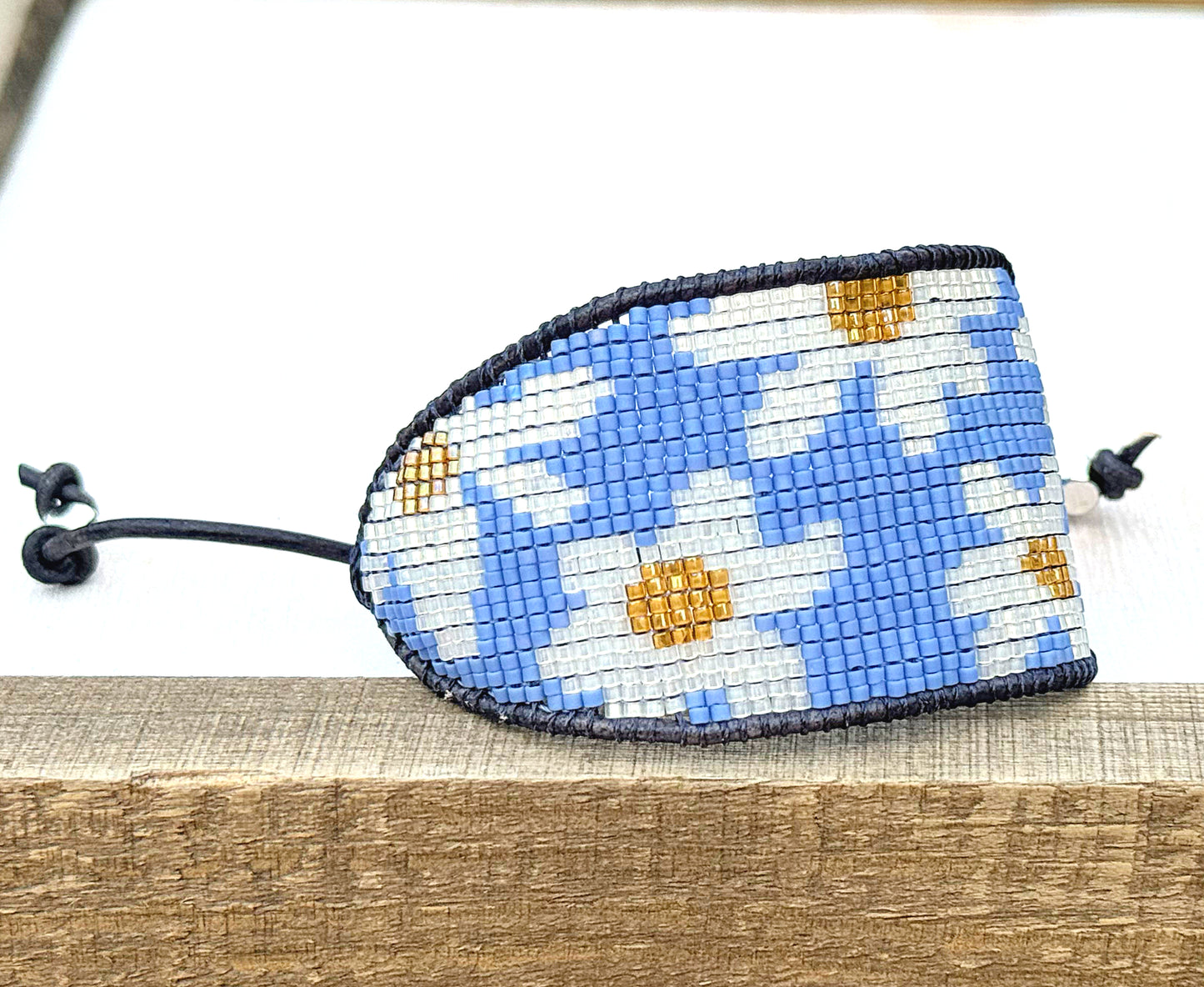 Blue and white boho flower bead loom woven bracelet with slide adjustment