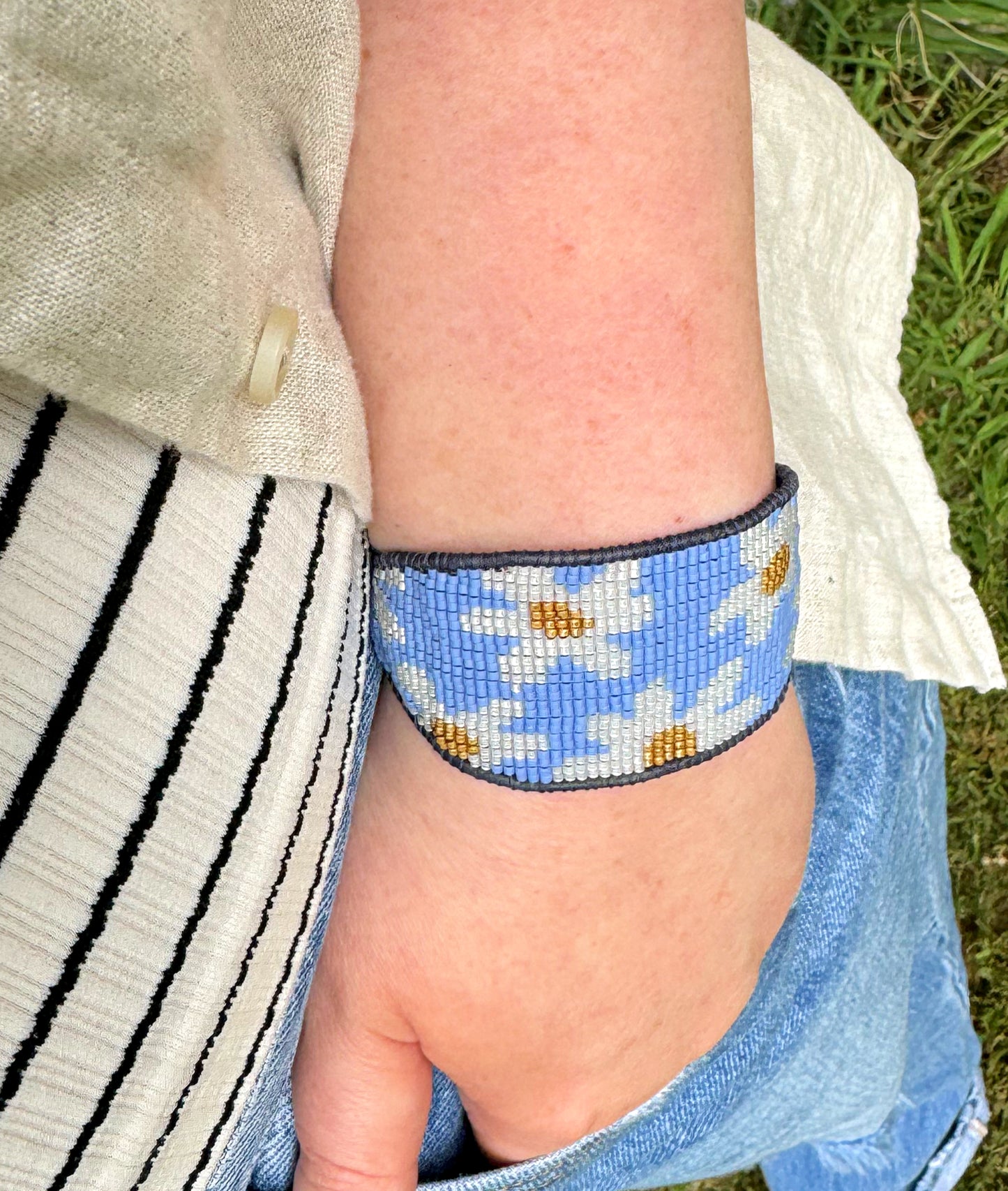 Blue and white boho flower bead loom woven bracelet with slide adjustment