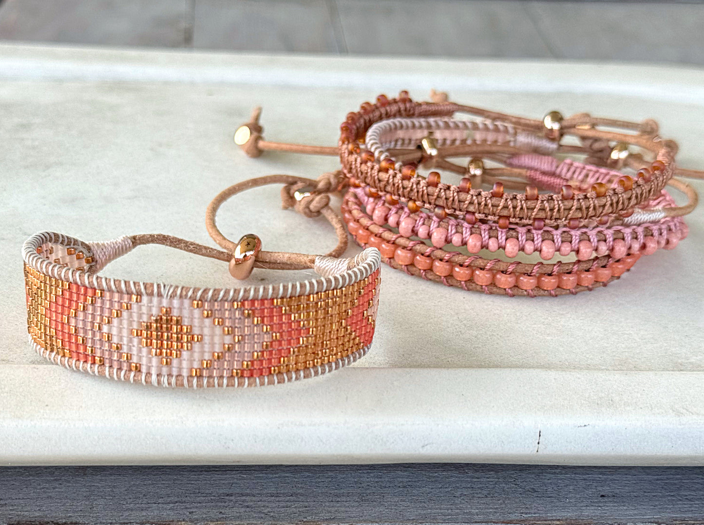 Peachy Coral and Tan Adjustable Bead Loom Woven bracelet with leather trim