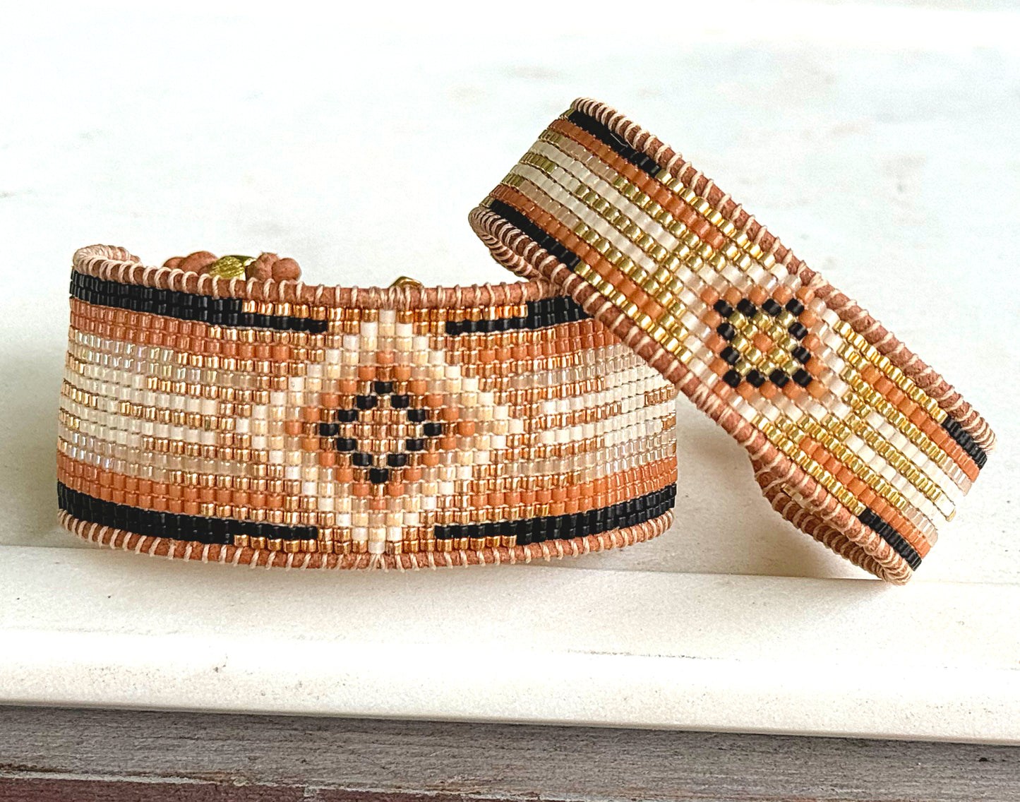 Gold, Honey Tan, and Black Starburst Bead Loom Woven bracelet trimmed with leather