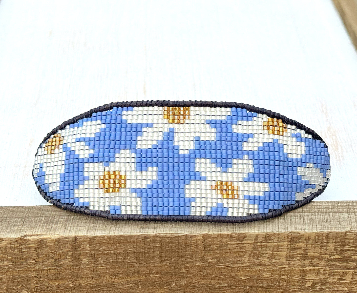Blue and white boho flower bead loom woven bracelet with slide adjustment