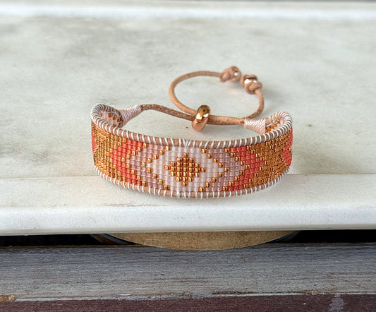 Peachy Coral and Tan Adjustable Bead Loom Woven bracelet with leather trim