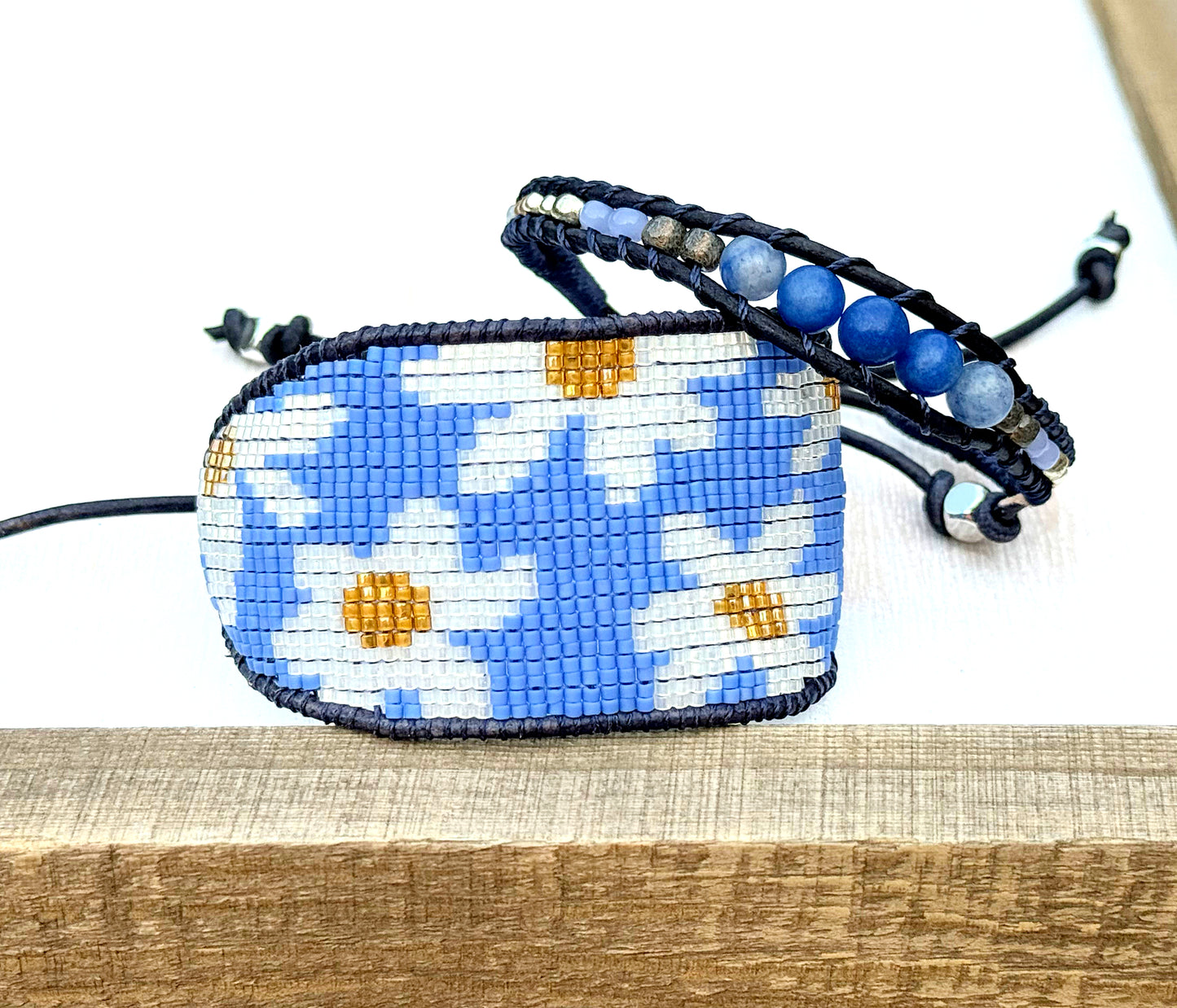 Blue and white boho flower bead loom woven bracelet with slide adjustment