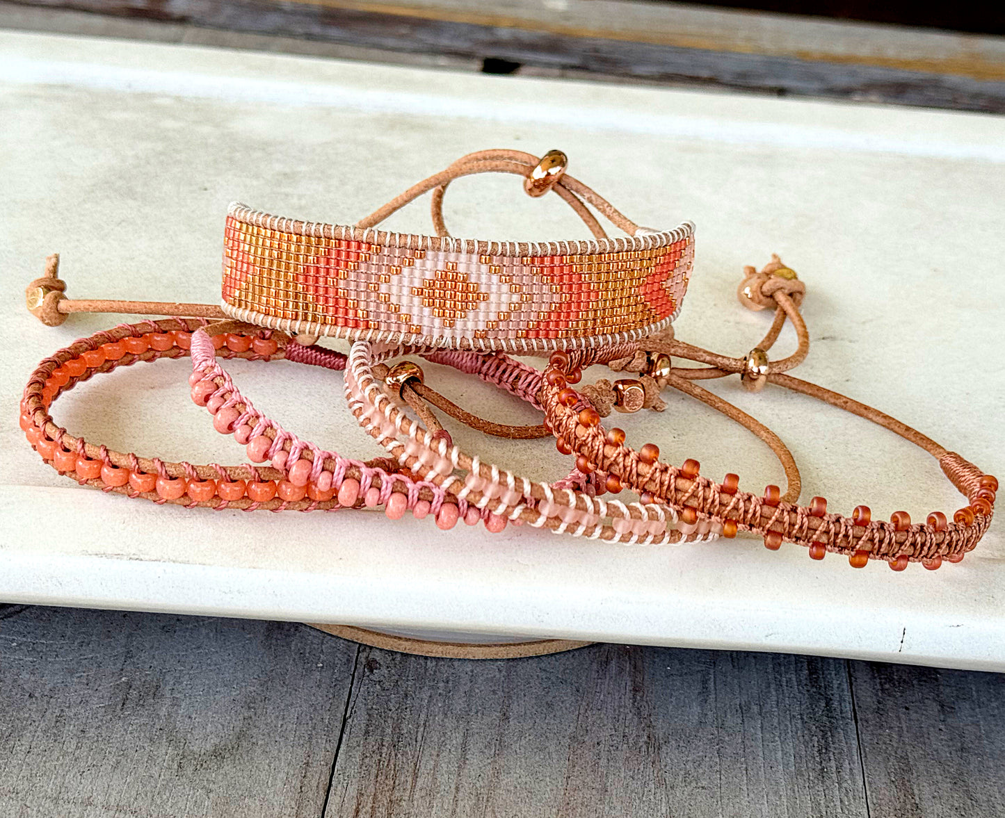 Peachy Coral and Tan Adjustable Bead Loom Woven bracelet with leather trim