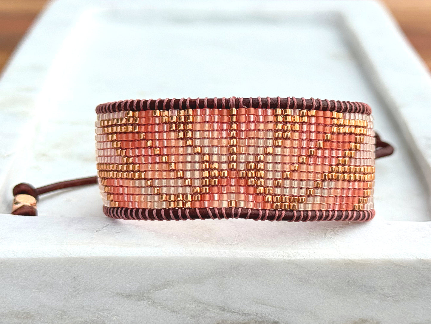 Beige, Blush, and Copper Starburst Bead Loom Woven Bracelet with slide adjustable leather