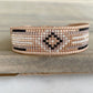 Gold, Honey Tan, and Black Starburst Bead Loom Woven bracelet trimmed with leather