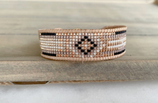 Gold, Honey Tan, and Black Starburst Bead Loom Woven bracelet trimmed with leather