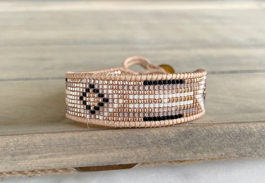 Gold, Honey Tan, and Black Starburst Bead Loom Woven bracelet trimmed with leather