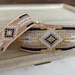 Gold, Beige, and Black Starburst Bead Loom Woven bracelet trimmed with leather
