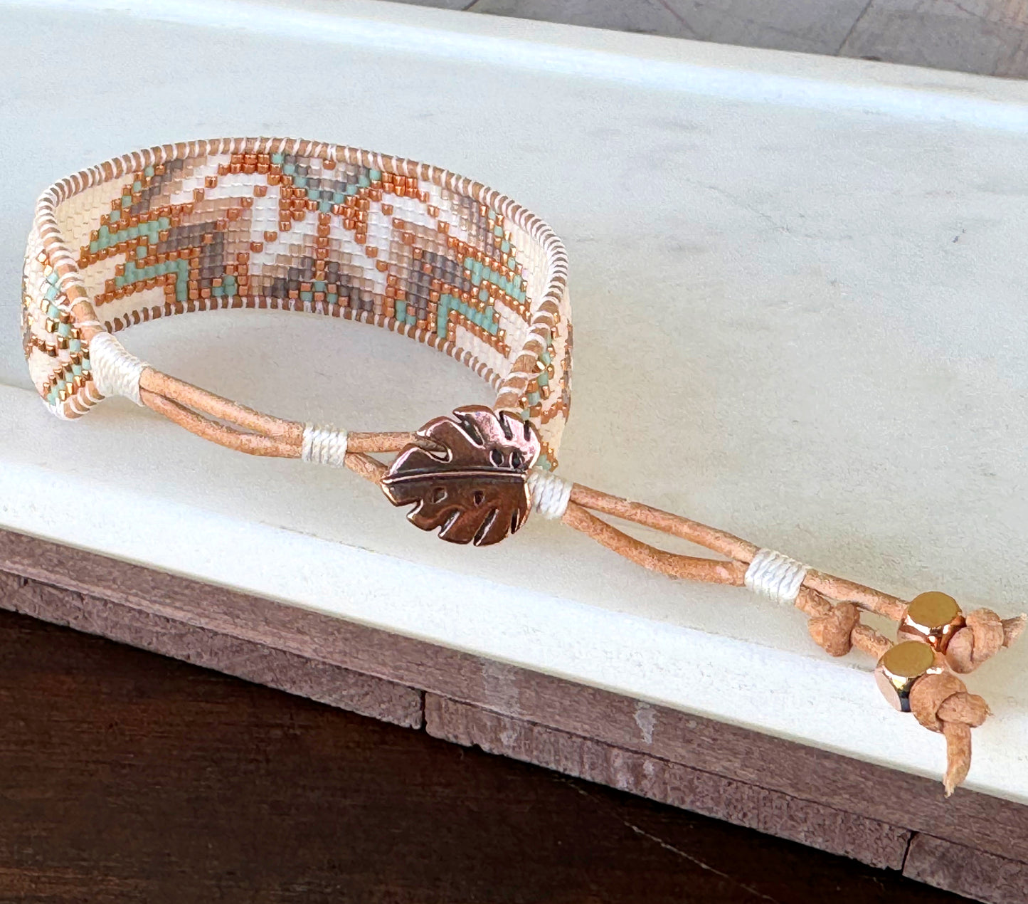 Sage, Ivory, Copper Starburst beaded loom woven bracelet trimmed with leather