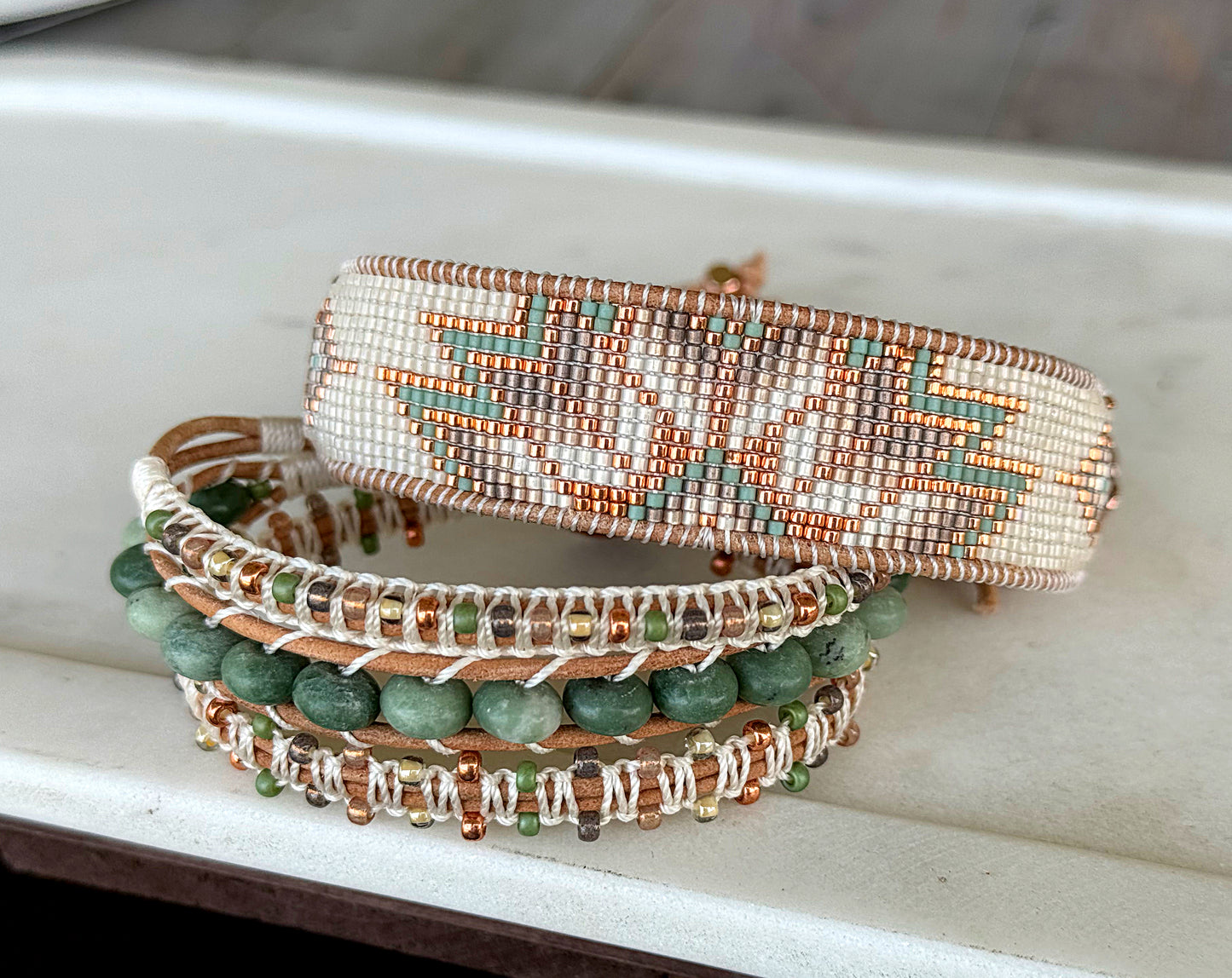 Sage, Ivory, Copper Starburst beaded loom woven bracelet trimmed with leather