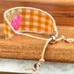 Strawberry Bead Loom Woven bracelet with yellow gingham
