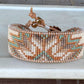 Sage, Ivory, Copper Starburst beaded loom woven bracelet trimmed with leather