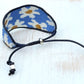 Blue and white boho flower bead loom woven bracelet with slide adjustment