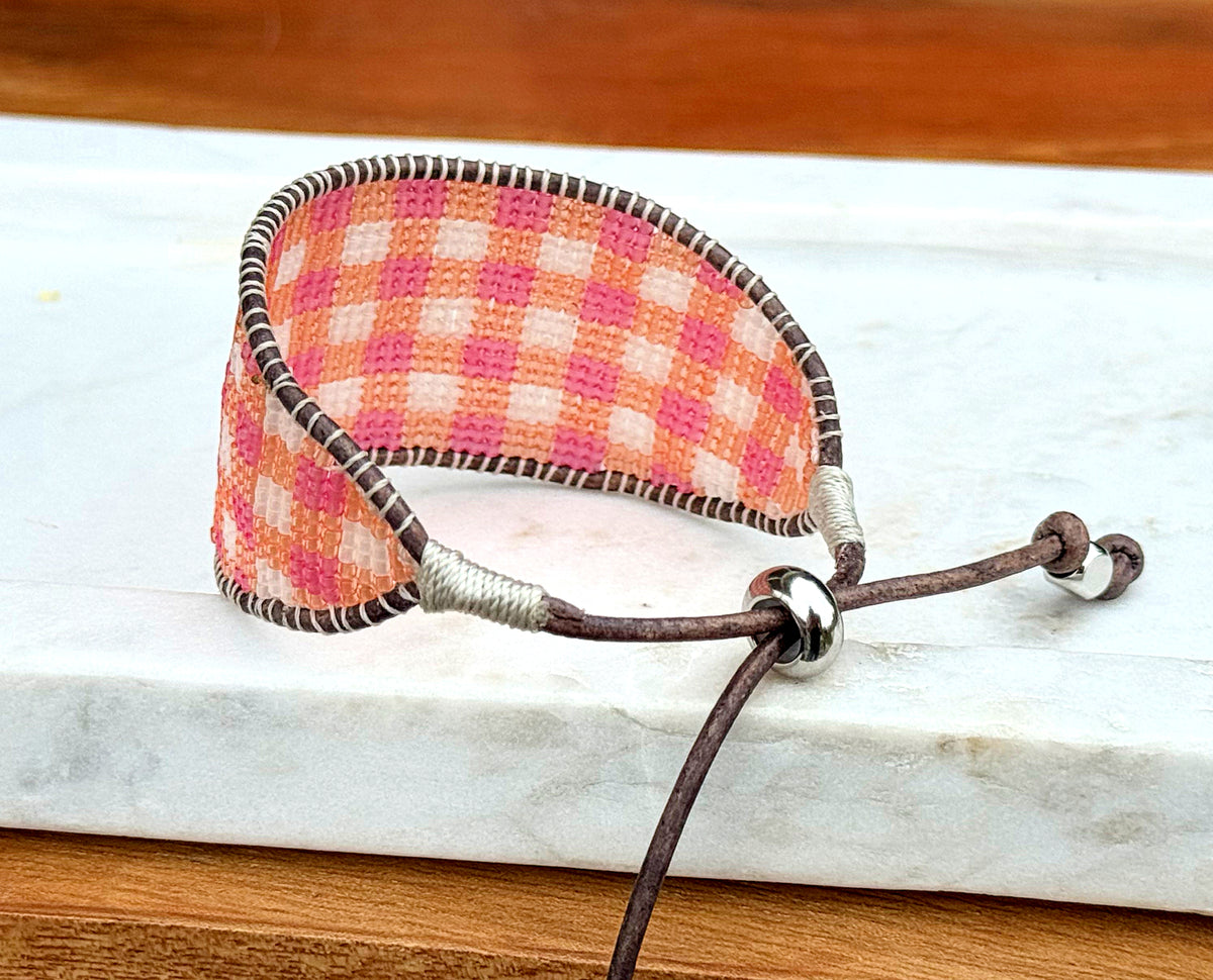 Pink and orange Gingham Bead Loom woven bracelet with adjustable leather trim