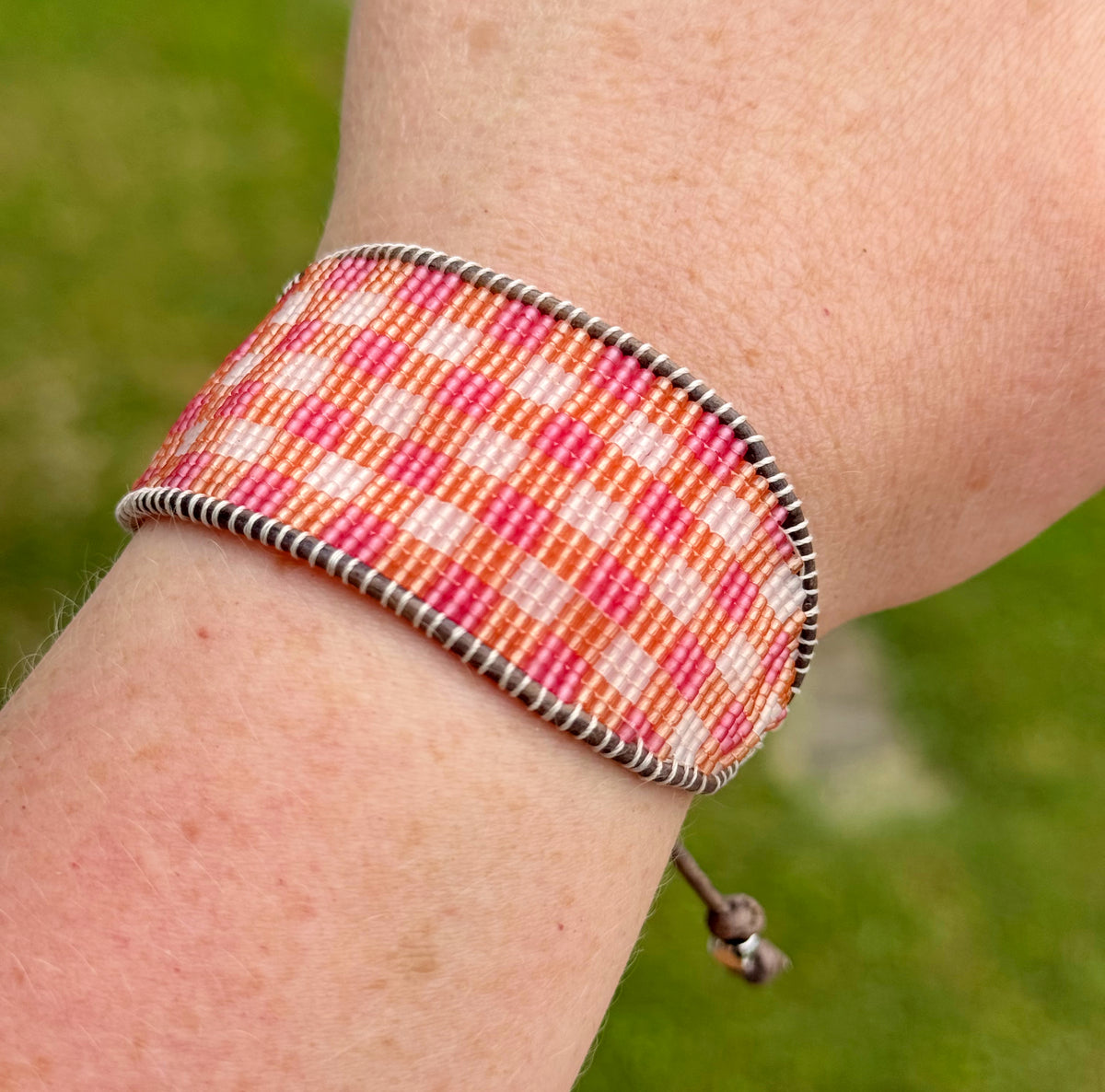 Pink and orange Gingham Bead Loom woven bracelet with adjustable leather trim