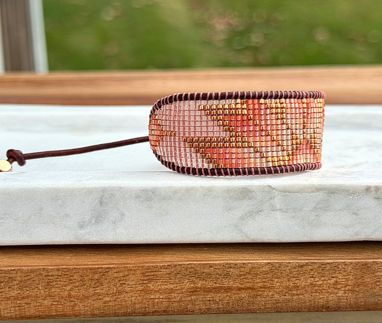 Beige, Blush, and Copper Starburst Bead Loom Woven Bracelet with slide adjustable leather