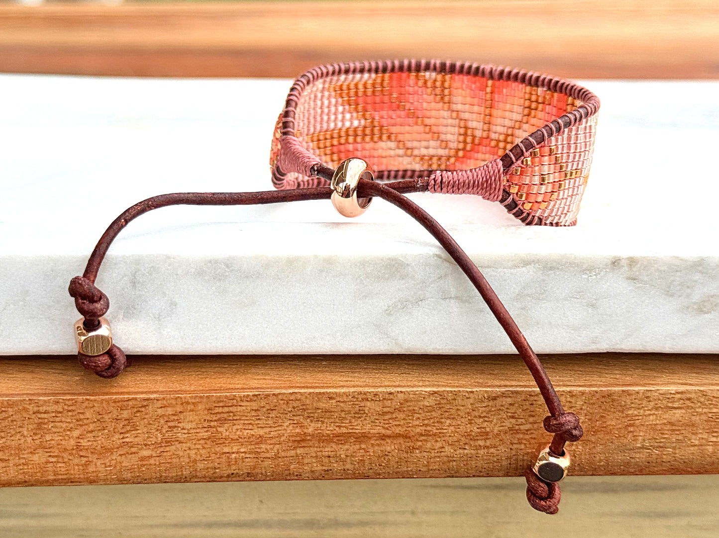 Beige, Blush, and Copper Starburst Bead Loom Woven Bracelet with slide adjustable leather