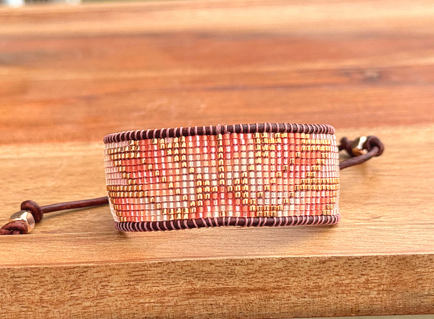 Beige, Blush, and Copper Starburst Bead Loom Woven Bracelet with slide adjustable leather