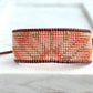 Beige, Blush, and Copper Starburst Bead Loom Woven Bracelet with slide adjustable leather