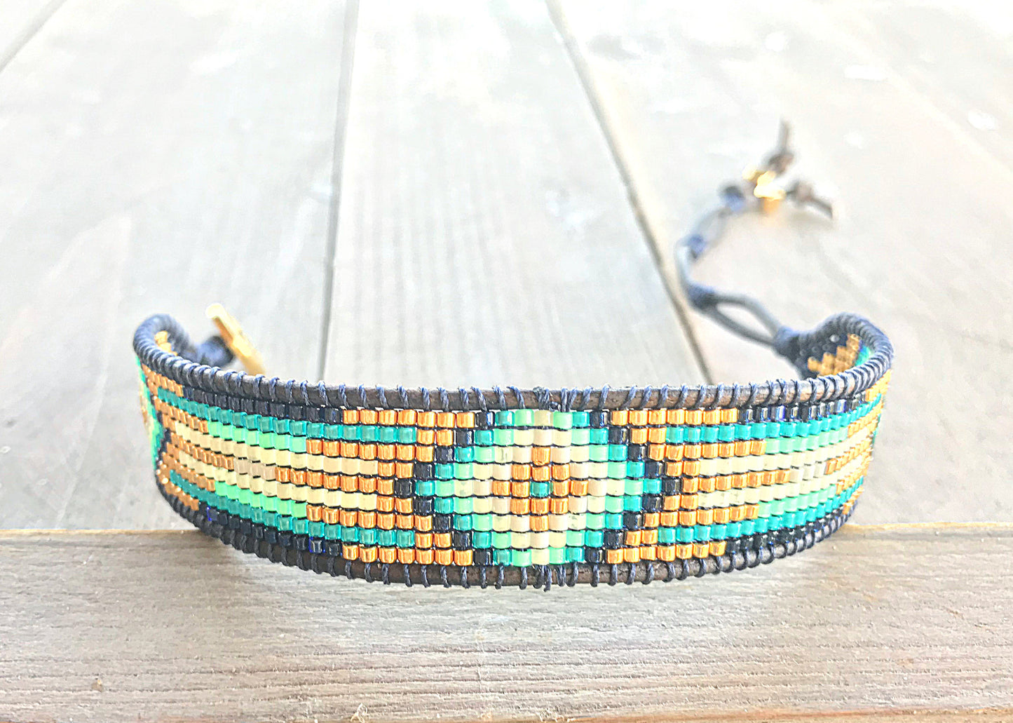 Gold, Navy, and Seafoam Starburst Bead Loom Woven Leather bracelet