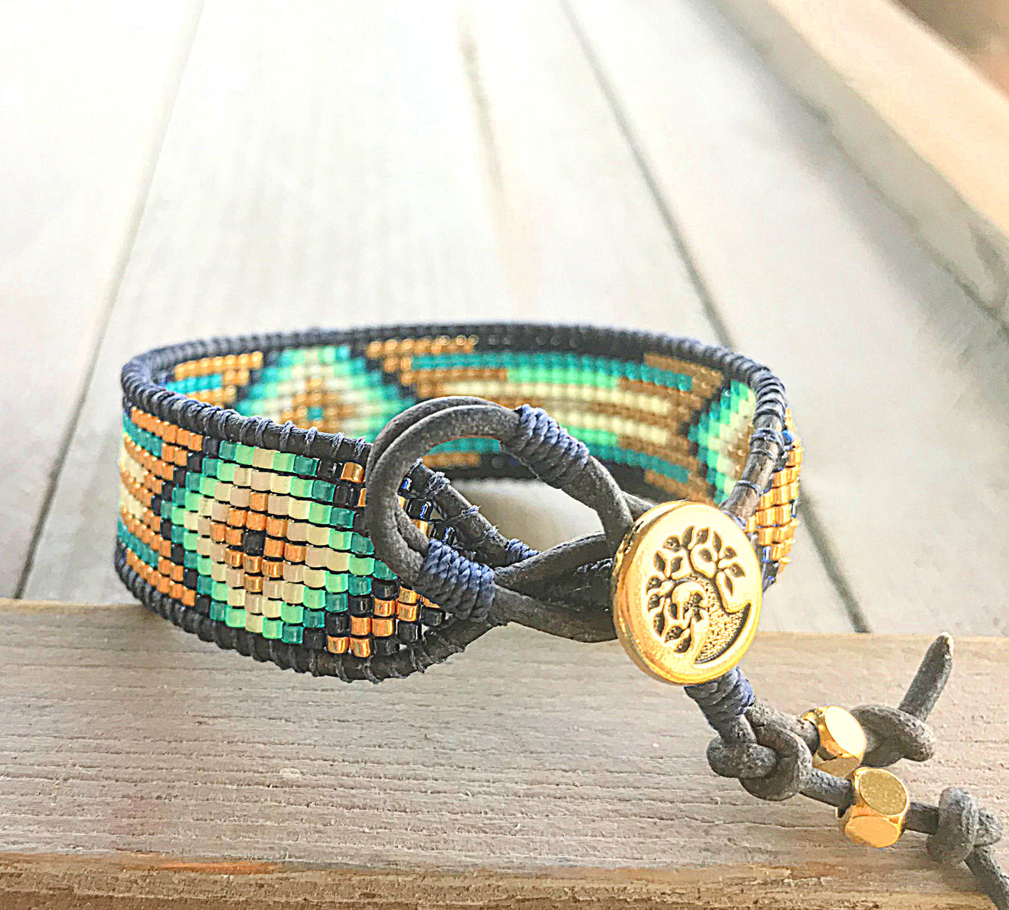 Gold, Navy, and Seafoam Starburst Bead Loom Woven Leather bracelet