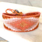 Tan and Coral Bead Loom Woven Diamond Burst Bracelet