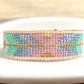 Purple, Green, and Gold Geometric Arrow Bead Loom Woven Bracelet